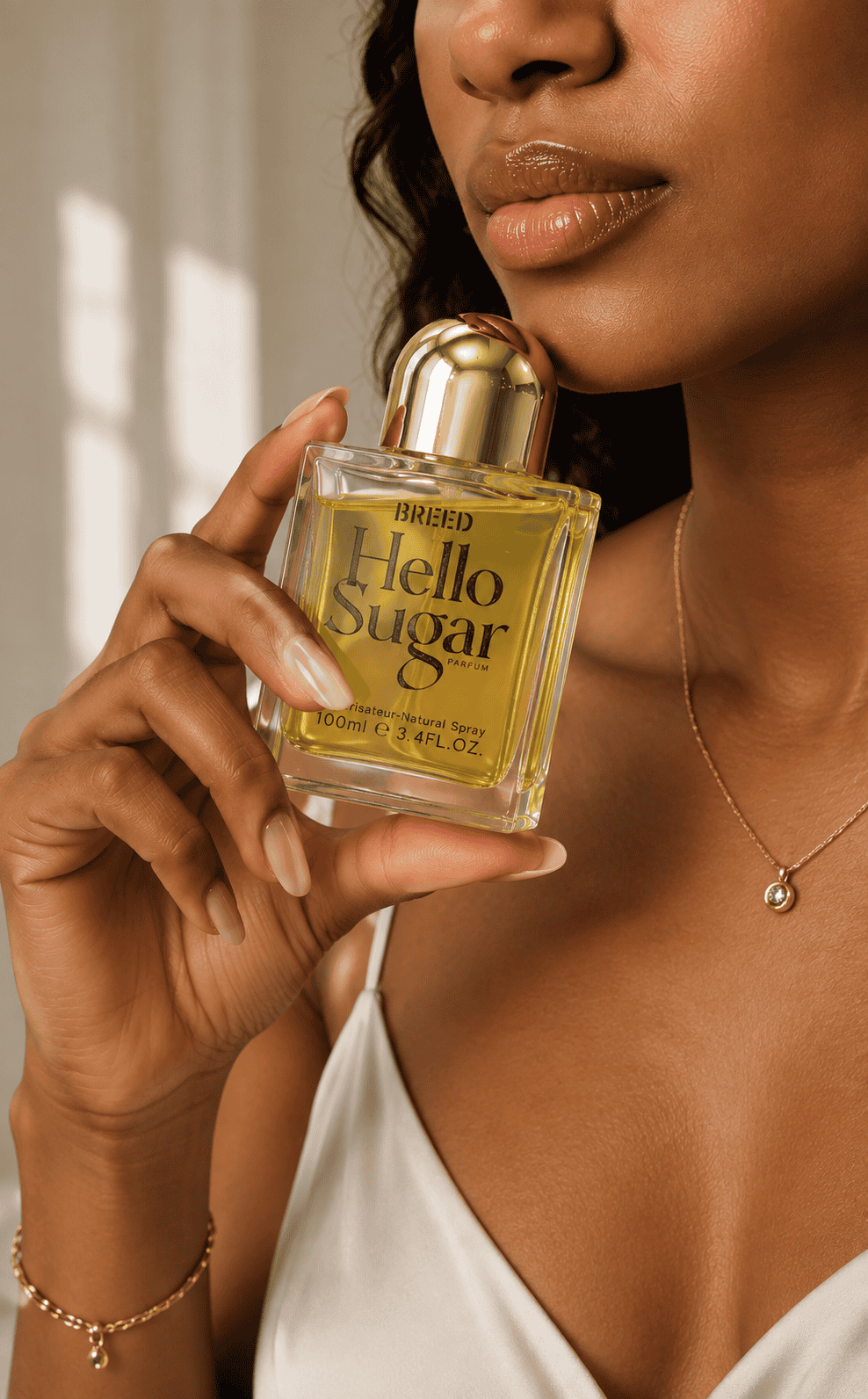 Woman holding a perfume bottle